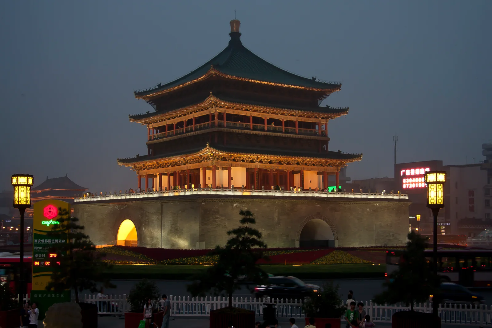 Xi’an’s Bell Tower illuminated at dusk, with its tiered roofs above the stone base.